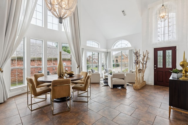 5312 Ridgeson Dr, Mckinney, TX 75071 - dining room with high vaulted ceiling and a chandelier