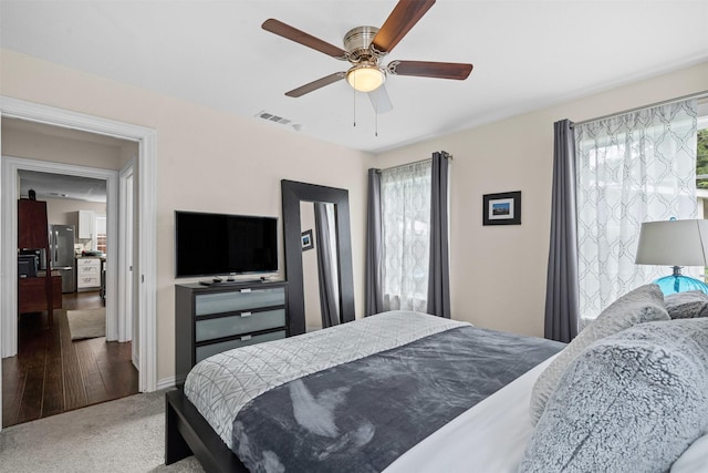 4204 Geddes Ave, Fort Worth, TX 76107 - bedroom featuring freestanding refrigerator, ceiling fan, and carpet floors