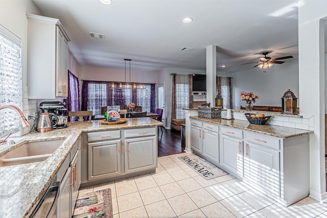 1617 Wood Ridge Ct, Corinth, TX 76210 - kitchen featuring a peninsula, gray cabinets, ceiling fan, and recessed lighting