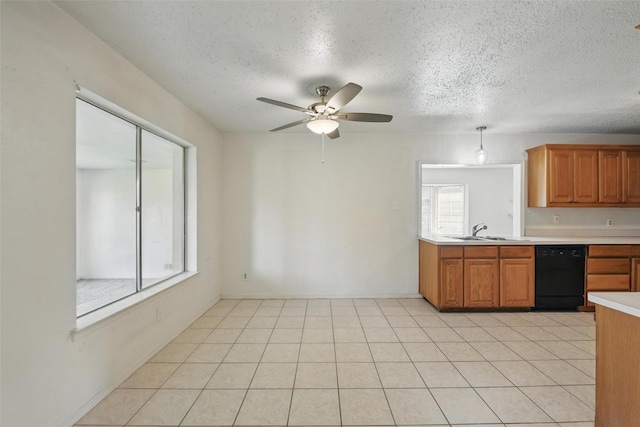 2015 Shenandoah Dr, Carrollton, TX 75007 - kitchen with dishwasher, light countertops, a textured ceiling, ceiling fan, and brown cabinetry