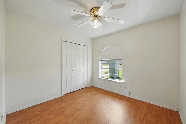 2015 Shenandoah Dr, Carrollton, TX 75007 - unfurnished bedroom with a closet, wood finished floors, and a ceiling fan