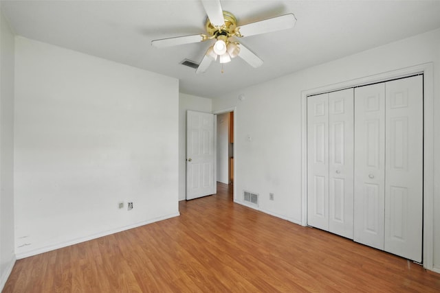 2015 Shenandoah Dr, Carrollton, TX 75007 - unfurnished bedroom featuring light wood-style floors, a closet, and ceiling fan