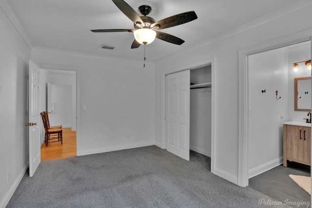 208 Arthur Ave, Shreveport, LA 71105 - unfurnished bedroom featuring carpet floors, ornamental molding, a ceiling fan, and a closet