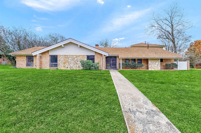 1632 Andy Dr, Sherman, TX 75092 - ranch-style house featuring a front lawn, a chimney, brick siding, and a shingled roof