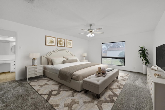 1632 Andy Dr, Sherman, TX 75092 - carpeted bedroom featuring a ceiling fan and ensuite bath