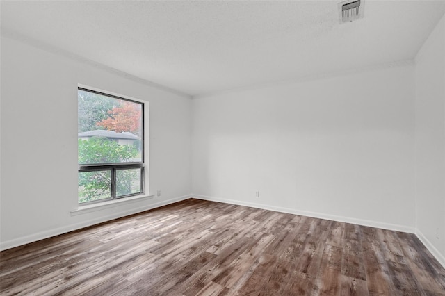 1632 Andy Dr, Sherman, TX 75092 - empty room featuring wood finished floors and baseboards