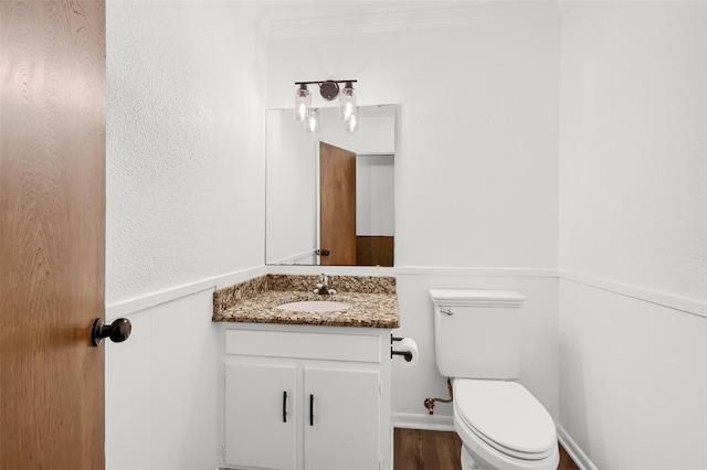 1632 Andy Dr, Sherman, TX 75092 - bathroom with vanity, wainscoting, and wood finished floors