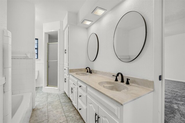1632 Andy Dr, Sherman, TX 75092 - full bathroom featuring a shower with shower door, double vanity, a tub to relax in, and tile patterned flooring