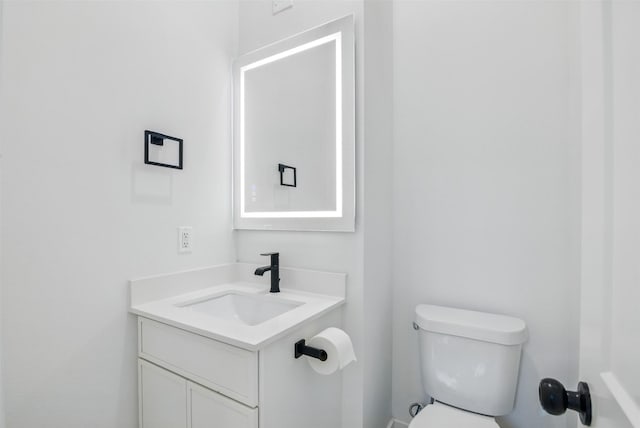 430 E 8th Unit 101, Dallas, TX 75203 - half bathroom featuring vanity and toilet