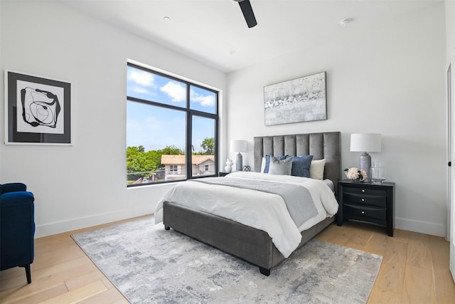 430 E 8th Unit 101, Dallas, TX 75203 - bedroom with wood finished floors and a ceiling fan