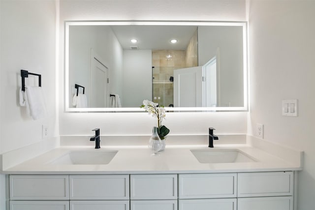 430 E 8th Unit 101, Dallas, TX 75203 - bathroom featuring double vanity, a shower stall, and recessed lighting