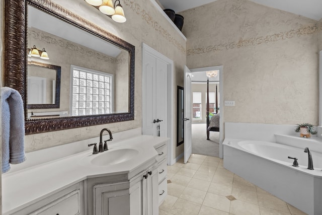 5820 Woodwind Dr, Plano, TX 75093 - bathroom featuring a garden tub, vanity, ensuite bathroom, and tile patterned floors
