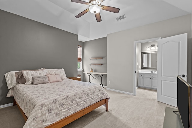 5820 Woodwind Dr, Plano, TX 75093 - bedroom with light carpet, ensuite bath, and a ceiling fan