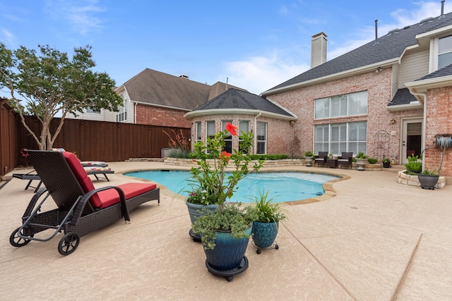 5820 Woodwind Dr, Plano, TX 75093 - view of swimming pool with a patio and a fenced backyard