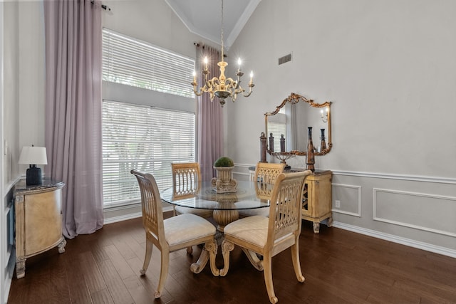 5820 Woodwind Dr, Plano, TX 75093 - dining space with crown molding, a chandelier, dark wood finished floors, wainscoting, and high vaulted ceiling