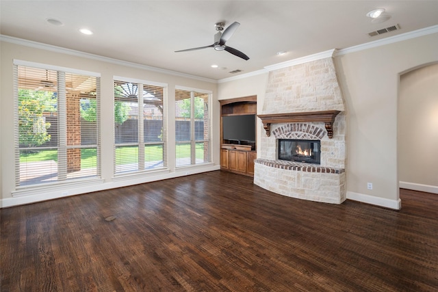 11560 Mirage Ln, Frisco, TX 75033 - unfurnished living room featuring ceiling fan, a fireplace, crown molding, dark wood finished floors, and recessed lighting