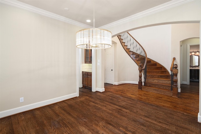 11560 Mirage Ln, Frisco, TX 75033 - spare room with stairs, a chandelier, dark wood-style flooring, arched walkways, and ornamental molding
