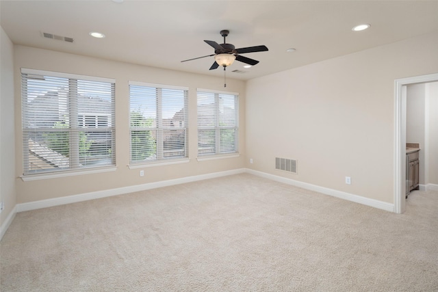 11560 Mirage Ln, Frisco, TX 75033 - unfurnished room featuring healthy amount of natural light, light colored carpet, ceiling fan, and recessed lighting