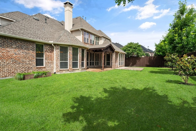11560 Mirage Ln, Frisco, TX 75033 - rear view of property with a shingled roof, a patio area, brick siding, and a chimney