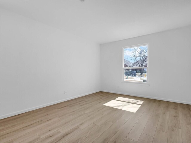 9741 Indian Canyon Dr, Plano, TX 75025 - unfurnished room featuring wood finished floors and baseboards