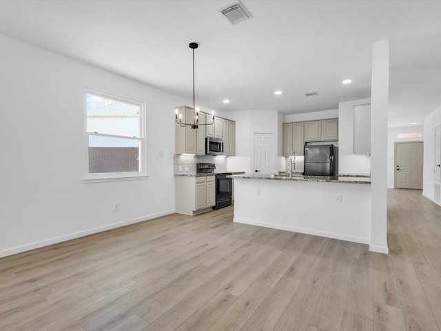 9741 Indian Canyon Dr, Plano, TX 75025 - kitchen with black appliances, backsplash, light wood-style floors, recessed lighting, and a chandelier