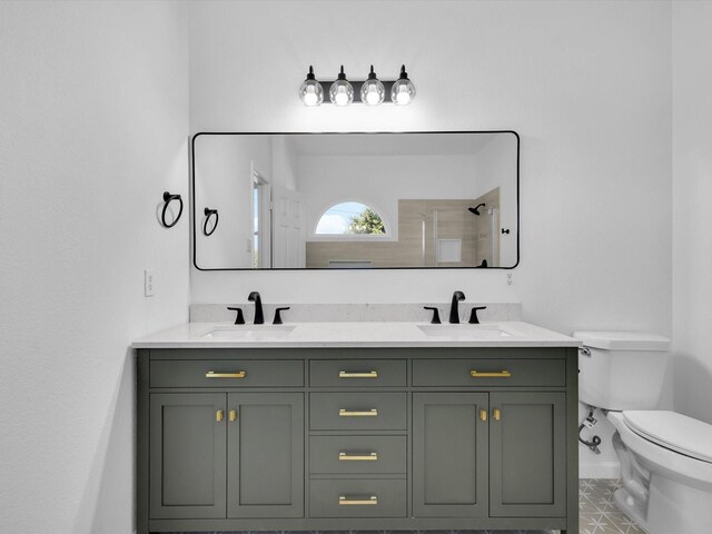 9741 Indian Canyon Dr, Plano, TX 75025 - bathroom with double vanity, a shower, and tile patterned flooring