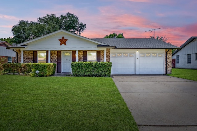 7920 Donegal Ln, North Richland Hills, TX 76180 - view of front of house with an attached garage, a front yard, driveway, and brick siding