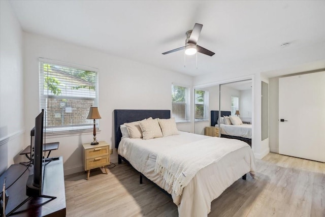 7920 Donegal Ln, North Richland Hills, TX 76180 - bedroom with light wood-style flooring, a closet, and a ceiling fan