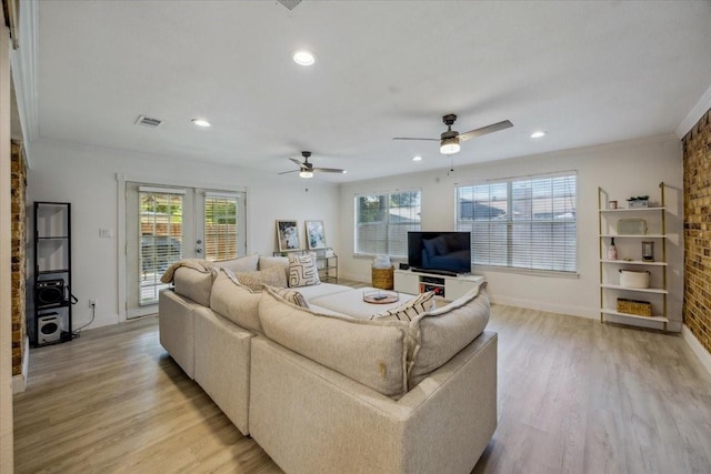 7920 Donegal Ln, North Richland Hills, TX 76180 - living room with light wood-type flooring, crown molding, recessed lighting, a ceiling fan, and french doors