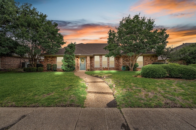 2305 Delmar Dr, Plano, TX 75075 - view of front of house with brick siding, a front lawn, and a shingled roof