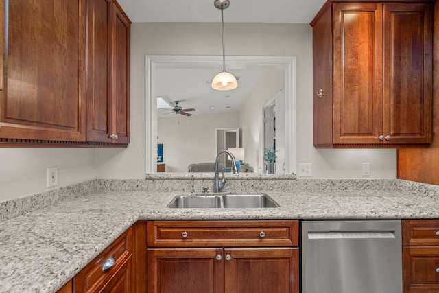 2305 Delmar Dr, Plano, TX 75075 - kitchen with dishwasher, ceiling fan, decorative light fixtures, brown cabinetry, and light stone counters