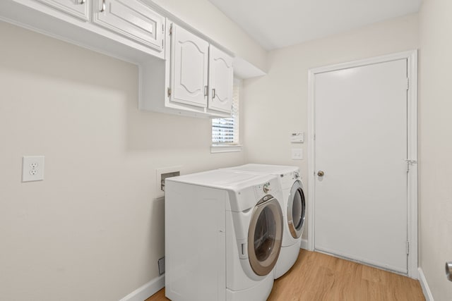 2305 Delmar Dr, Plano, TX 75075 - washroom featuring cabinet space, washer and clothes dryer, and light wood finished floors