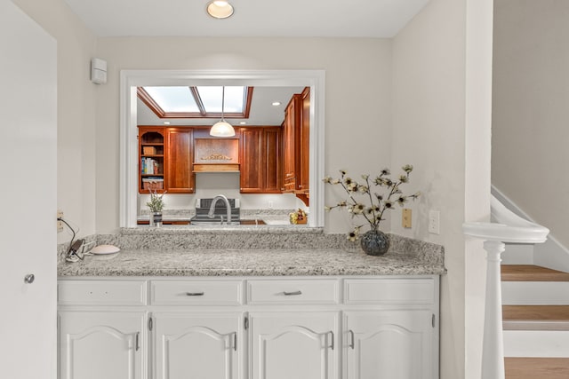 2305 Delmar Dr, Plano, TX 75075 - kitchen featuring white cabinets, recessed lighting, and light stone countertops