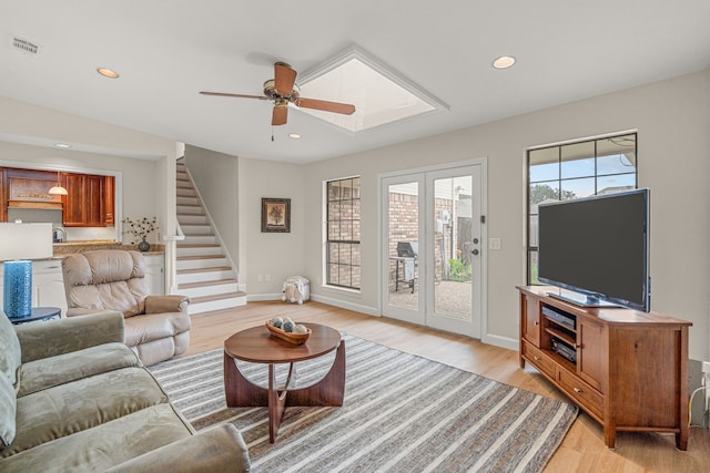 2305 Delmar Dr, Plano, TX 75075 - living room with a ceiling fan, light wood-style floors, stairs, and recessed lighting