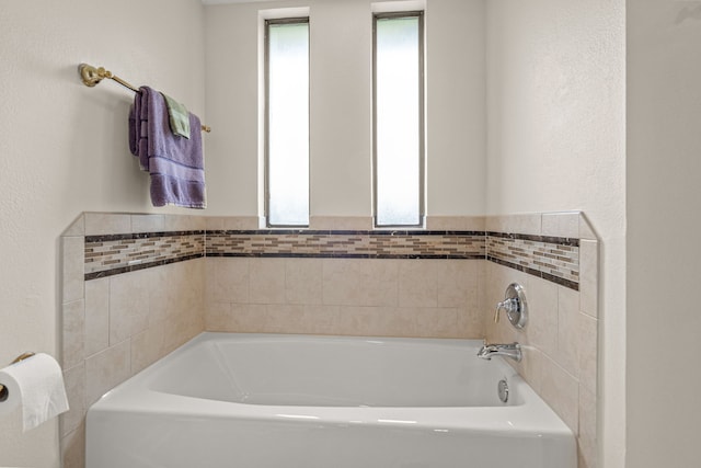 2305 Delmar Dr, Plano, TX 75075 - bathroom with plenty of natural light and a bath