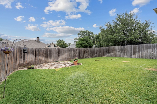 2305 Delmar Dr, Plano, TX 75075 - fenced backyard with a patio area