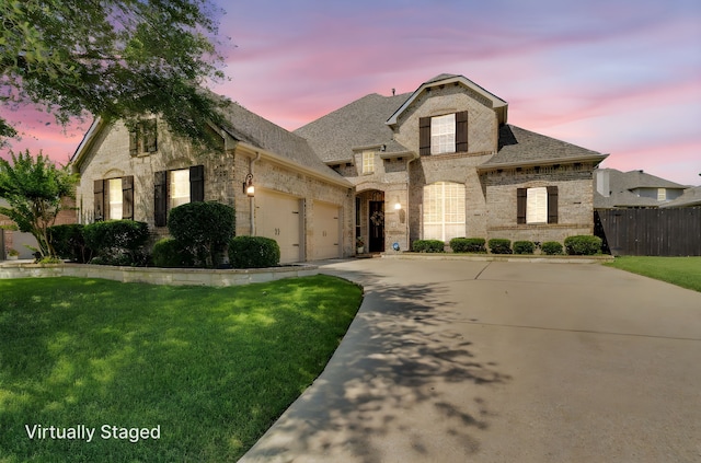 1809 Lake Glen Trl, Mansfield, TX 76063 - french country style house featuring brick siding, a garage, concrete driveway, roof with shingles, and stone siding