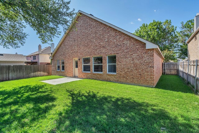 1940 Creek Crossing Dr, Fort Worth, TX 76247 - rear view of property with a patio, a fenced backyard, and brick siding