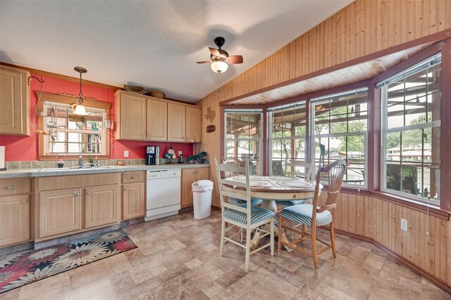 200 Dogwood Trl, Murchison, TX 75778 - kitchen with dishwasher, wooden walls, tile counters, stone finish flooring, and ceiling fan
