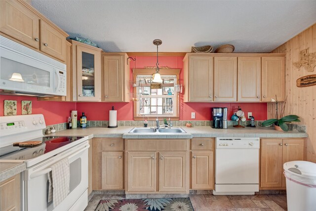 200 Dogwood Trl, Murchison, TX 75778 - kitchen featuring white appliances, light brown cabinetry, light countertops, hanging light fixtures, and glass insert cabinets