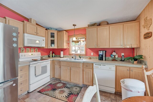 200 Dogwood Trl, Murchison, TX 75778 - kitchen with white appliances, light brown cabinets, light countertops, stone finish floors, and glass insert cabinets