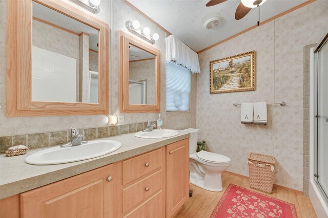200 Dogwood Trl, Murchison, TX 75778 - full bath with lofted ceiling, an enclosed shower, wood finished floors, double vanity, and a ceiling fan
