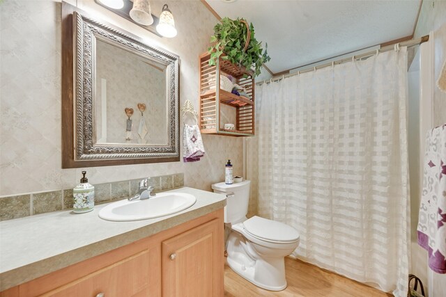 200 Dogwood Trl, Murchison, TX 75778 - bathroom featuring vanity, wood finished floors, and a shower with curtain