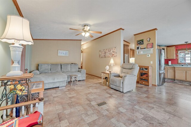 200 Dogwood Trl, Murchison, TX 75778 - living area featuring ornamental molding, a ceiling fan, and stone finish floors