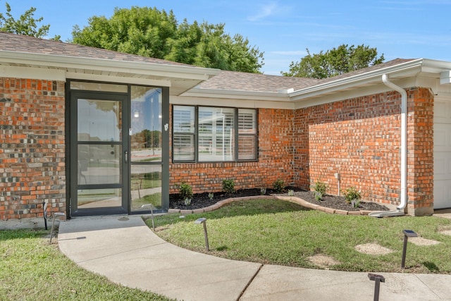 7424 Bridges Ave, Richland Hills, TX 76118 - entrance to property with brick siding, a yard, a shingled roof, and a garage