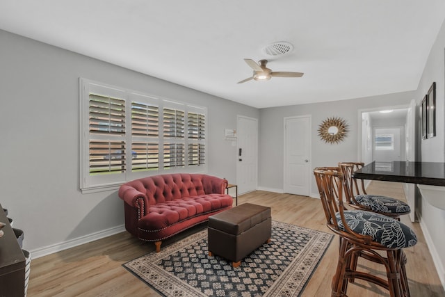 7424 Bridges Ave, Richland Hills, TX 76118 - living room with plenty of natural light, light wood finished floors, and ceiling fan