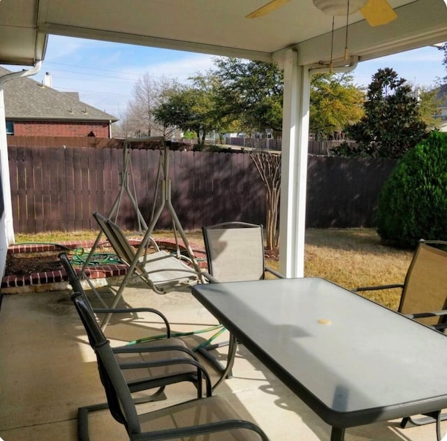 4924 Marsh Harrier Ave, Grand Prairie, TX 75052 - fenced backyard with ceiling fan, outdoor dining space, and a patio
