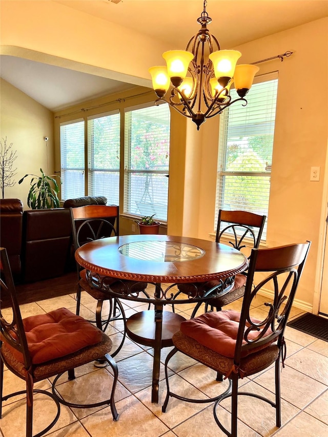 4924 Marsh Harrier Ave, Grand Prairie, TX 75052 - dining space with light tile patterned flooring, a chandelier, and vaulted ceiling