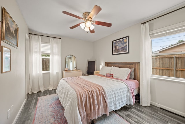 1218 Ridgeway Dr, Richardson, TX 75080 - bedroom featuring wood finished floors and ceiling fan