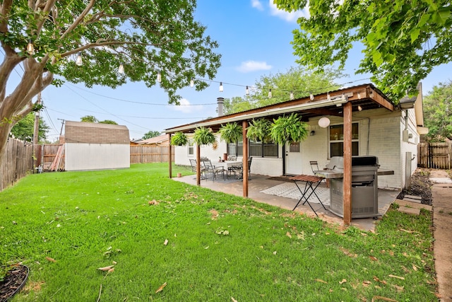 1218 Ridgeway Dr, Richardson, TX 75080 - fenced backyard featuring a patio and a storage unit